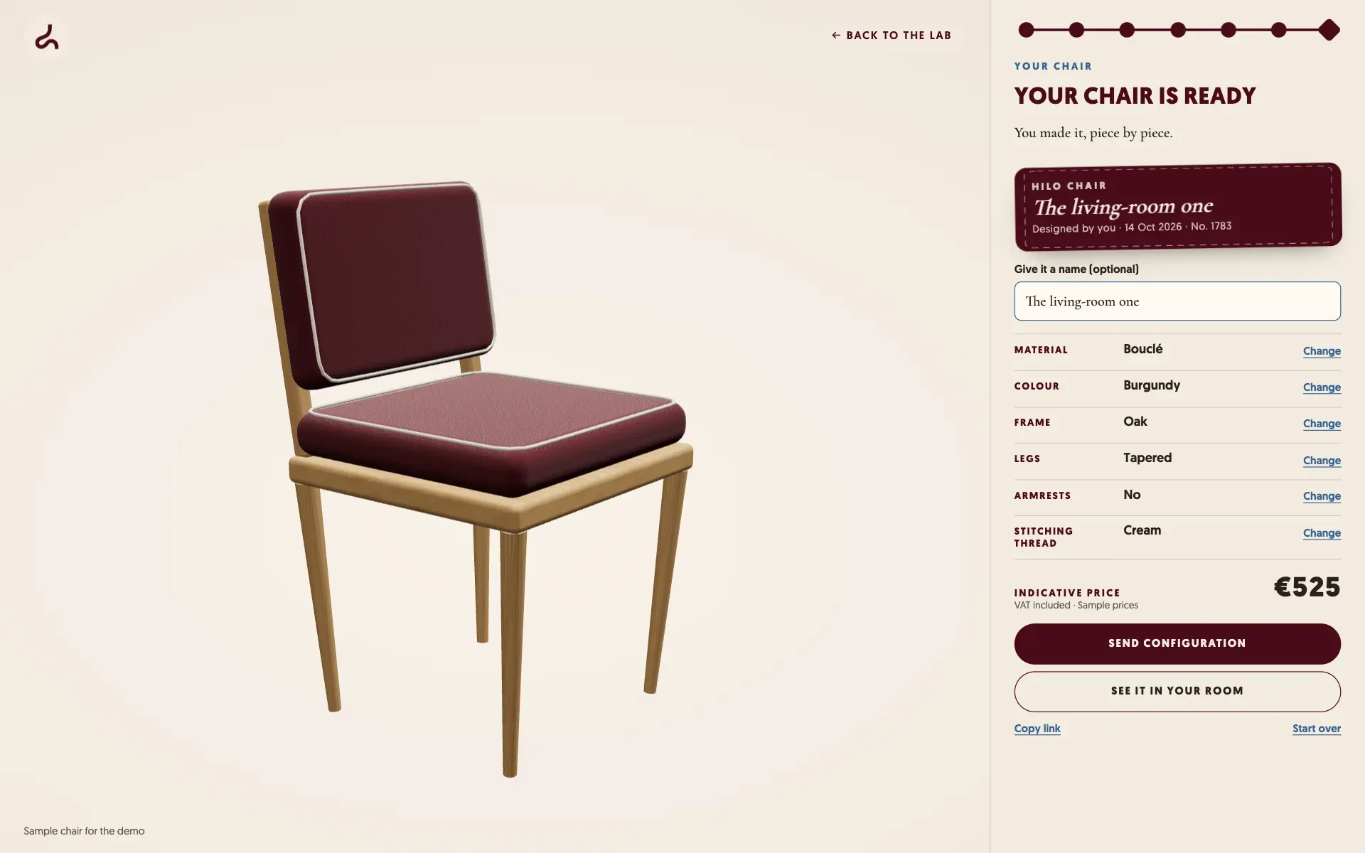 A finished chair upholstered in burgundy bouclé in the configurator, with its sewn label "The living-room one" and the configuration summary